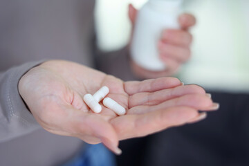 Taking Medication An InDepth Close Up View of Various Pills and Water for Hydration