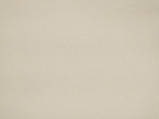 Highresolution image of a neutral beige textured wall. Perfect for backgrounds, website design, or architectural presentations.  Subtle texture adds visual interest without distraction.