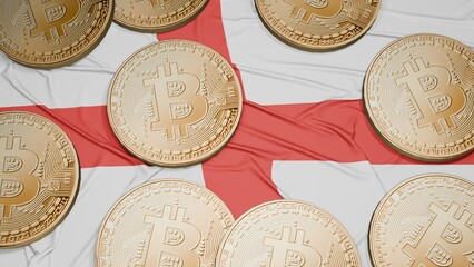 Several bitcoins are laid out on the flag of England