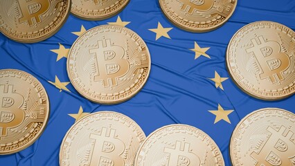 Several bitcoins are laid out on the flag of European Union