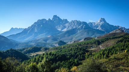 Obraz premium A mountain range with a blue sky.