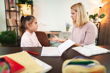 Heated discussion between a mother and daughter during study time at home