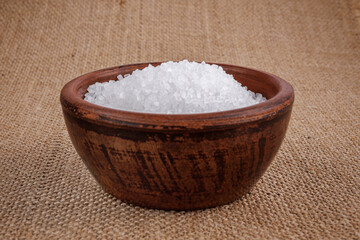 Clay cup with salt. table salt.
