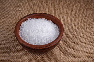 Clay cup with salt. table salt.