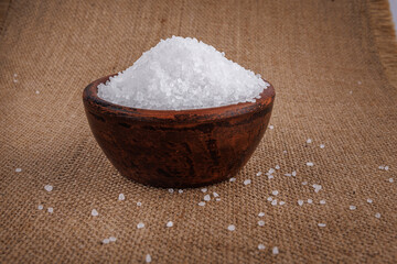 Clay cup with salt. table salt.