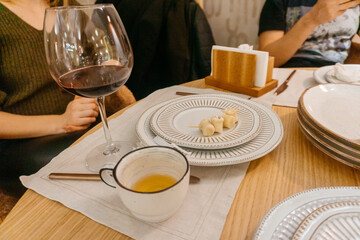 dirty plates on the table of a Georgian cafe. food-stained white plates