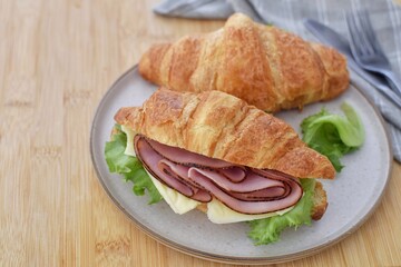 Croissants sandwich with ham and cheese.