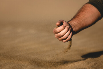 hands of the person, sand through hand, desert, dunes