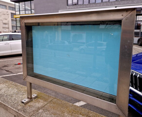 visiting rules, notice board in the town on the square, backlit glass cabinet with glass doors. gray steel with silver frame. club information and documents for pedestrians to see