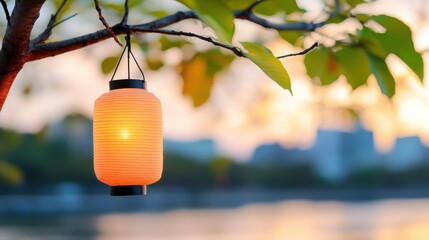 Warm glow of a paper lantern swaying gently in the evening breeze