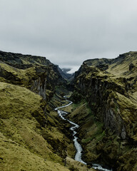 A dramatic aerial view of Klifuragil Canyon's rugged terrain in South Iceland