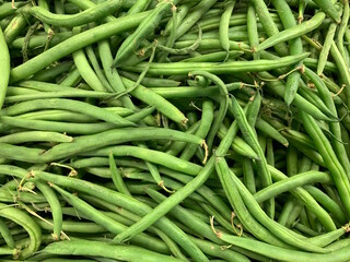 A bunch of green beans isolated against white background