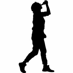 A man is drinking from a bottle. He is wearing a black shirt and black pants. The bottle is in his hand