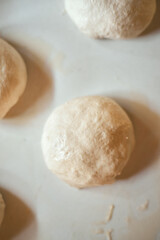 Preparation homemade pizza on kitchen table.