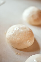 Preparation homemade pizza on kitchen table.