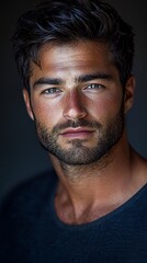 Obraz premium Handsome man portrait, studio lighting, dark background, for fashion