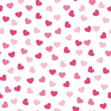 Seamless pattern of scattered pink hearts of various shades on a white background, vector illustration.