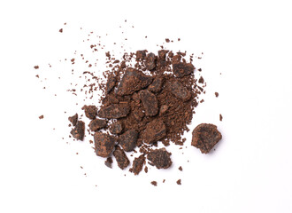 Chocolate pieces and powder isolated on white background. Top view.