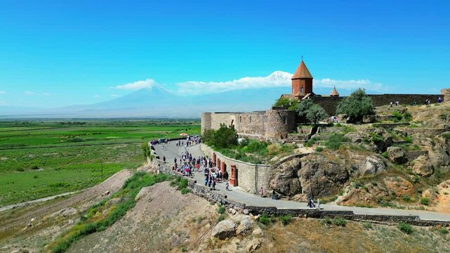  Aerial footage of Khor Virap monastery with Mount Ararat in the background, showcasing the historic Armenian landmark surrounded by scenic landscapes. Perfect for travel, history, and nature themes

