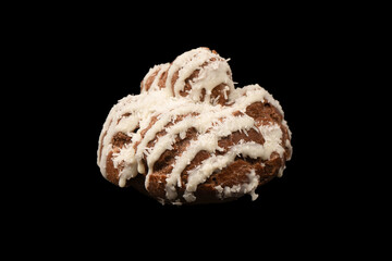 Profiteroles with coconut cream on a black background.