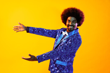 African man portrait in studio on colorful background - Cool black young male with stylish attire...