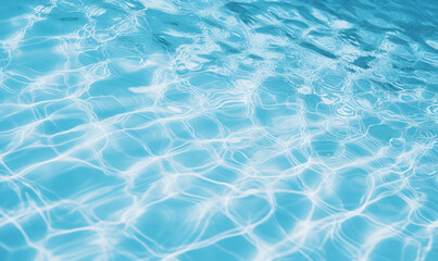 Obraz premium Close-up view of a tranquil blue water surface with sunlight reflections, creating a relaxing and refreshing summer vibe.