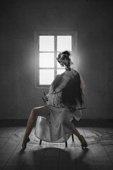 Terrifying woman in white gown, long claws, sit on a chair open mouth with black smoke appearing,...