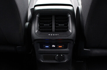Fototapeta premium Air ventilation for rear passengers. Deflectors for rear passengers. Climate control rear passengers, air ducts on car panel. 