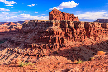 A rocky mountain range with a clear blue sky in the background