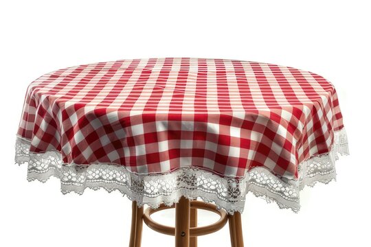 A round table covered with a red and white checkered tablecloth adorned with lace. isolated on white background