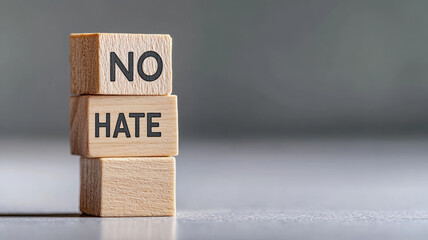 Wooden blocks stacked with "NO HATE" inscription, promoting kindness and positivity