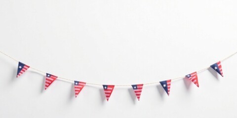 A festive bunting of miniature flags, strung on twine against a simple white backdrop, ideal for celebratory occasions