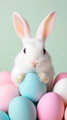 Obraz premium Hovering Easter eggs, fluffy white bunny in the foreground, soft peach background, open yellow space for promotional text.