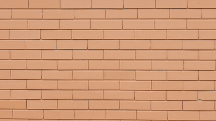 Modern orange brick wall forming an interesting textured background