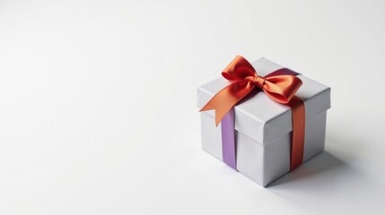 Obraz premium A Light Grey Gift Box with a Vibrant Orange and Purple Ribbon Bow on a White Background