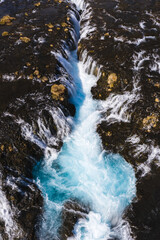 Fototapeta premium Aerial view of Bruarafoss waterfall with turquoise waters in south Iceland.