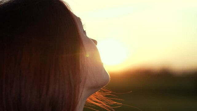girl look sky sunset gaze, girl look sky thoughtful horizon, girl look sky golden hour reflection, woman praying god contemplating dusk, religious person profile against sun, woman face look up