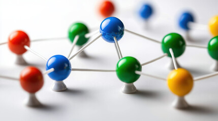 Obraz premium Colorful spheres connected in network on white surface