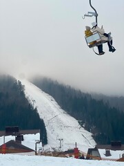 Two People on a Ski Lift in the Winter Carpathians