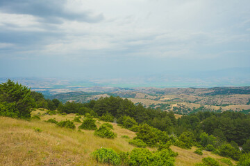 View from mountains across valley to south east with city of Stip on center horizon. Stip, Macedonia  