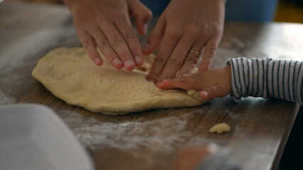 Hands baking dough preparation with baby toddler