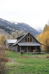 Fototapeta premium A charming rustic wooden cabin sits peacefully within a stunning autumn landscape, framed by majestic mountains and surrounded by shimmering golden foliage