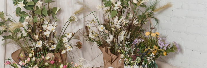 Interior floral Easter composition. Figurines of Easter bunnies and a large eggshell.