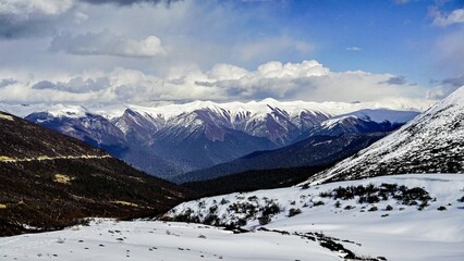 Majestic snowy mountains on the SichuanTibet plateau in Tibet under a bright blue sky
