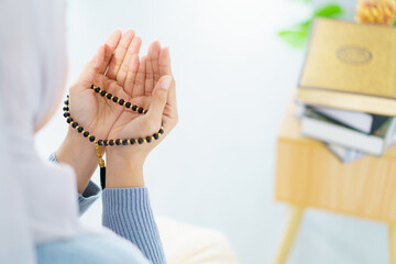Asian muslim woman praying for Allah.
