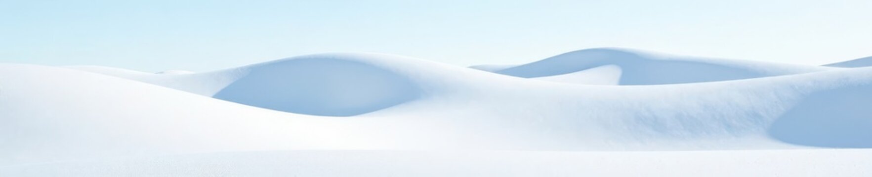 Undulating snow dunes, bright white expanse, stark beauty, unblemished, still