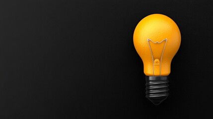 Illuminating Inspiration: A lone yellow light bulb against a black background evokes a sense of brilliance, creativity, and the power of ideas.