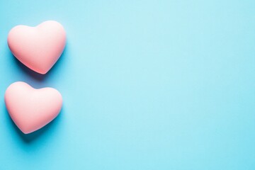 Fototapeta premium Pastel Pink Hearts on Light Blue Background Romantic Valentine's Day