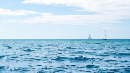 Fototapeta premium A tranquil ocean scene with a few sailboats in the distance, ocean scenery, soft focus