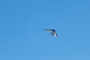 White Hang Glider against blue sky